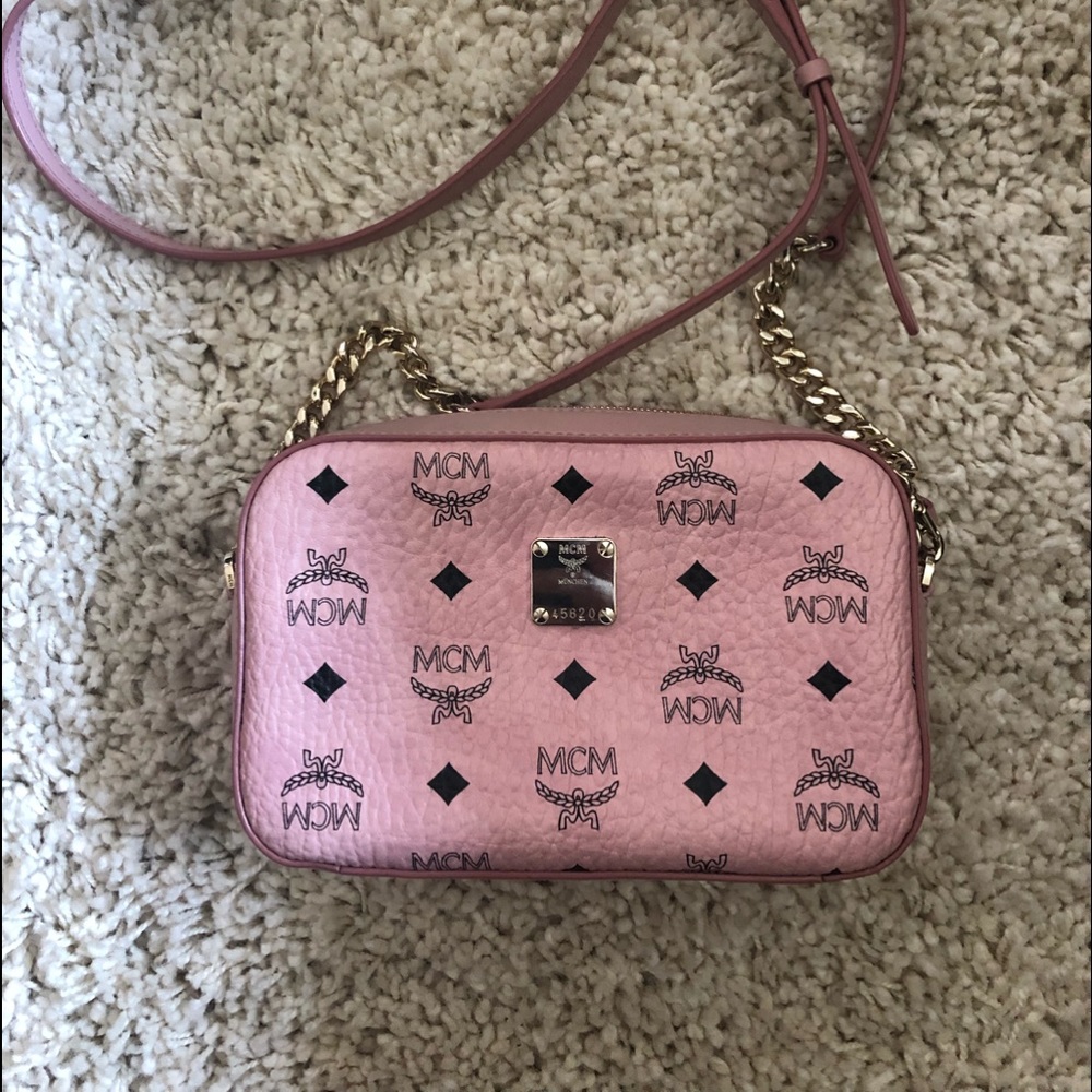 Pink MCM crossbody bag.